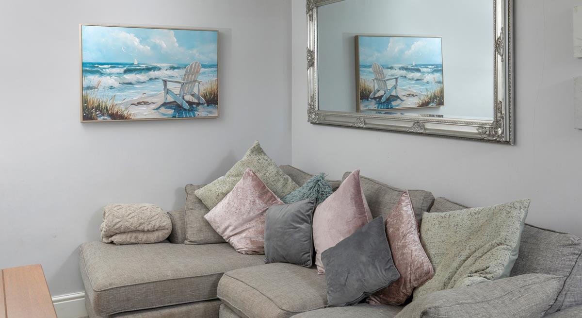 Snuggle up on the comfy corner sofa. 