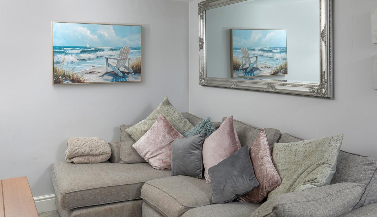 Snuggle up on the comfy corner sofa. 