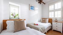 Bedroom 2 has twin beds perfect for kids or adults.