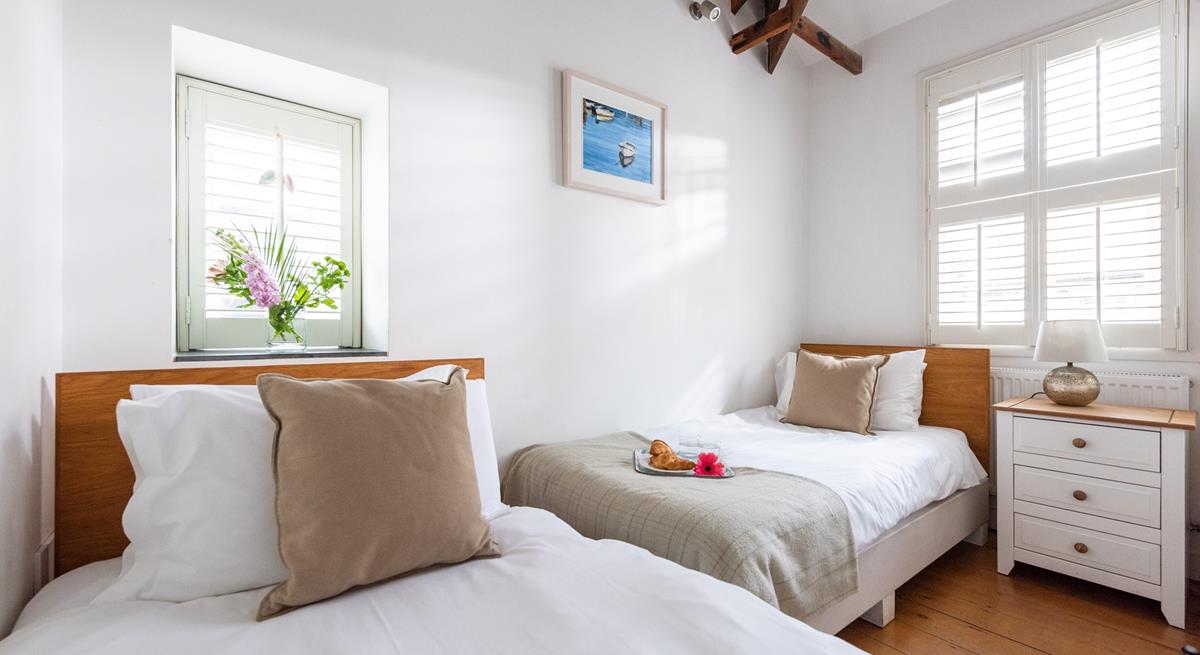 Bedroom 2 has twin beds perfect for kids or adults.