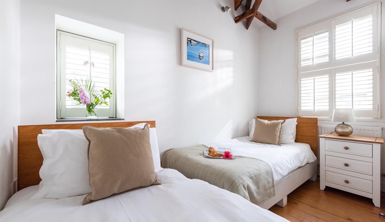 Bedroom 2 has twin beds perfect for kids or adults.