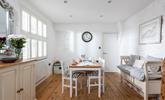Light and bright, the dining area is a great space to enjoy a hearty breakfast before heading out for the day. - Thumbnail Image