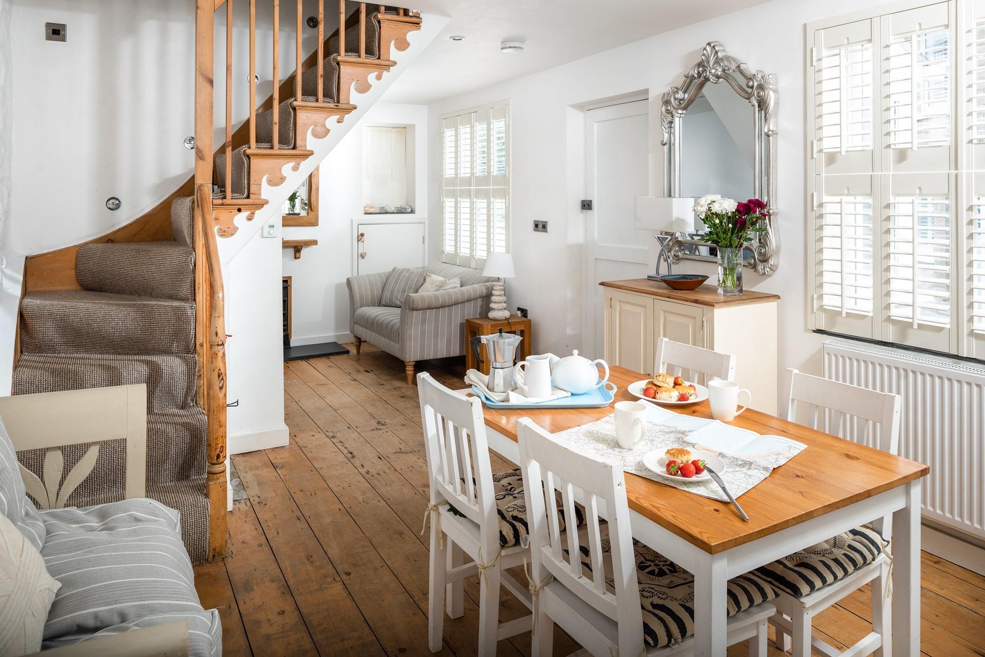 The open plan dining/sitting room is stylishly decorated, perfect for family dinners.