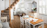 The open plan dining/sitting room is stylishly decorated, perfect for family dinners. - Thumbnail Image