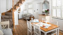 The open plan dining/sitting room is stylishly decorated, perfect for family dinners.