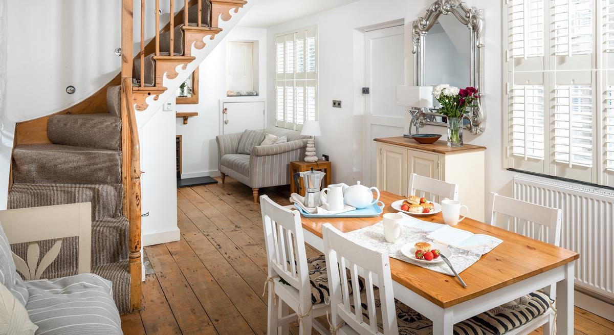 The open plan dining/sitting room is stylishly decorated, perfect for family dinners.