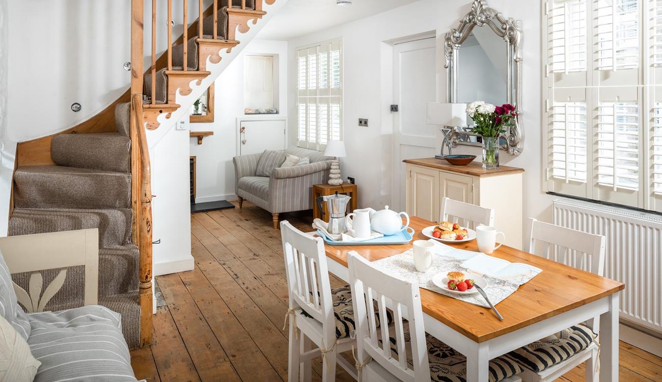 The open plan dining/sitting room is stylishly decorated, perfect for family dinners.