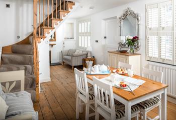 The open plan dining/sitting room is stylishly decorated, perfect for family dinners.