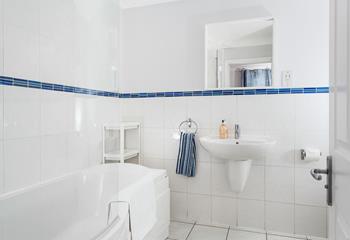The bathroom benefits from both a shower over and a bath, allowing you to soak away the sand after a day on the beach.