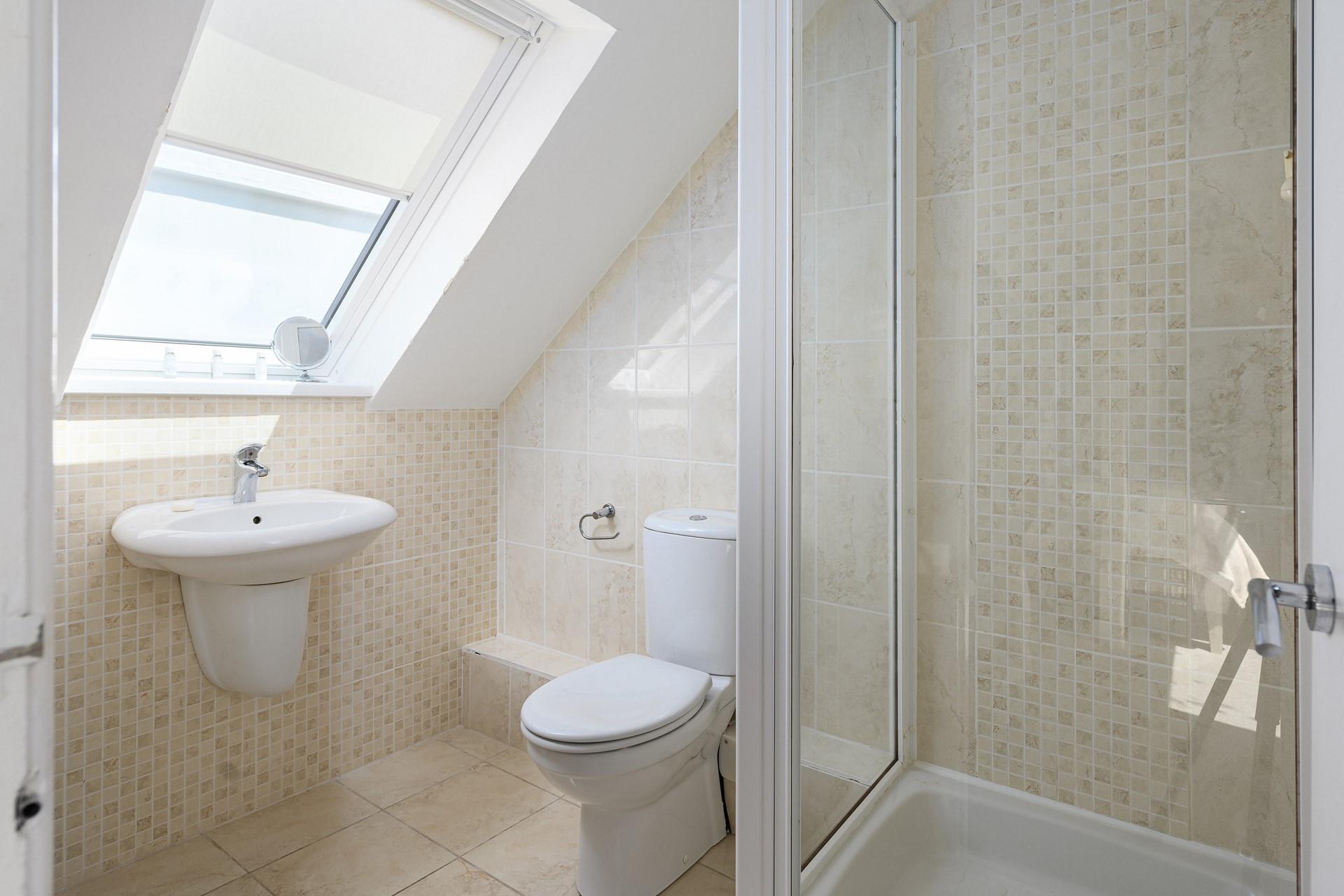 Wash off the sand in the spacious bathroom.