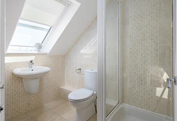 Wash off the sand in the spacious bathroom.