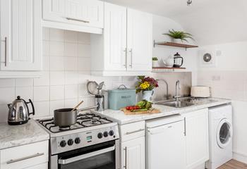 The stylish kitchen is well-equipped, making it easy to whip up delicious meals for your loved ones.