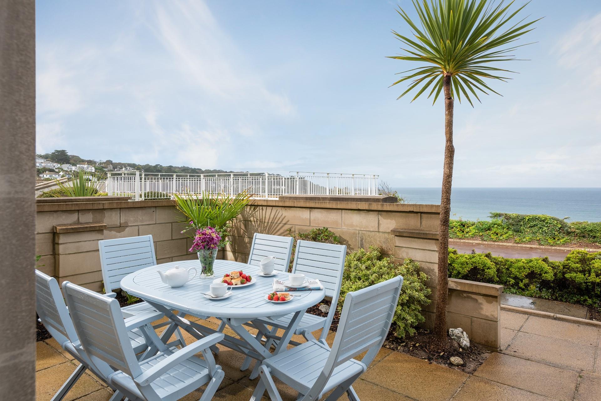 The patio is perfect for an afternoon cream tea in the sun. 