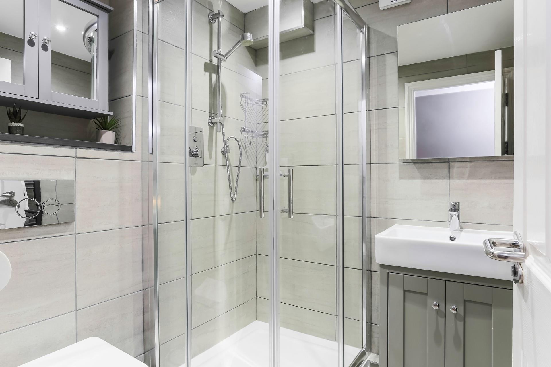 Wash off sandy toes in the en suite shower room.