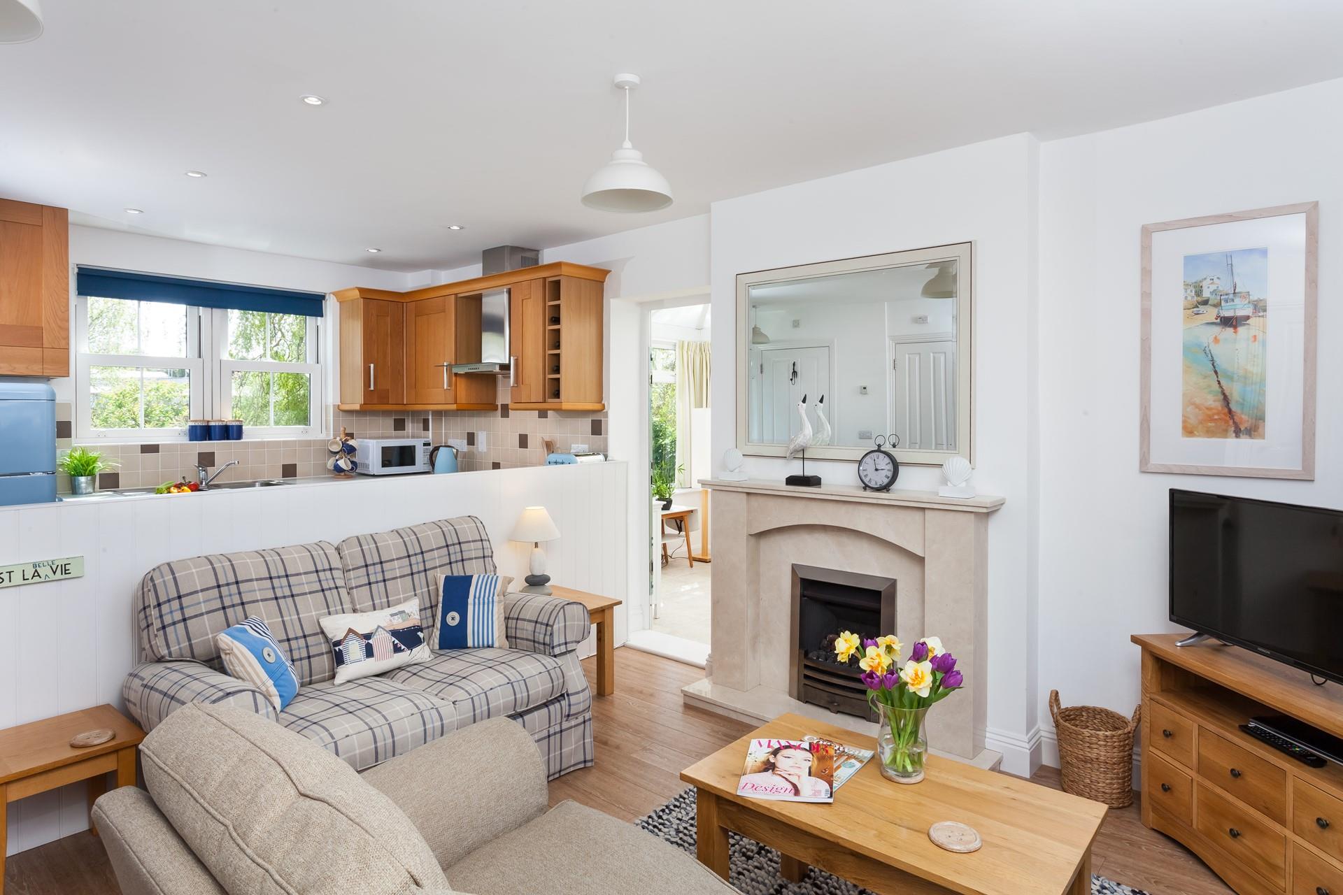 The cosy sitting room is a space to relax after a day exploring the South West Coast Path.