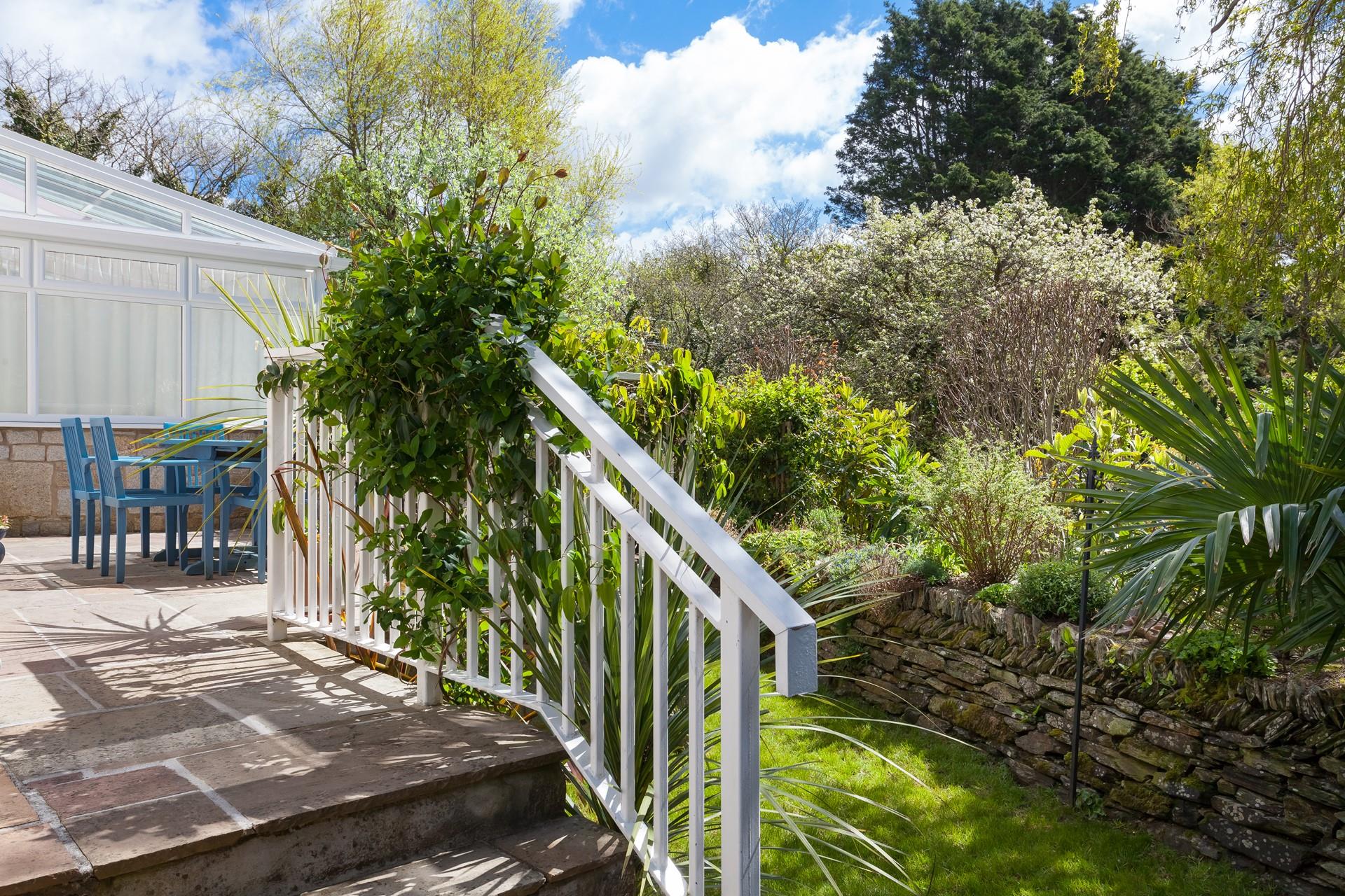 Relax in the tranquil garden and listen to the stream trickling in the background.