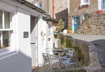 The outside area is a charming little sun trap, perfect for a morning coffee or an evening glass of wine.