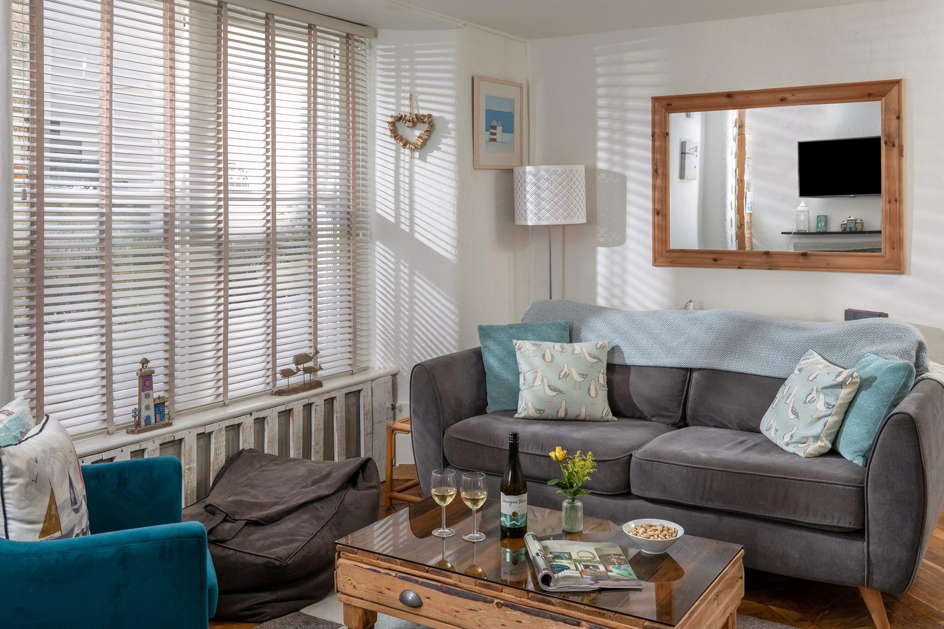 The living area offers ample room for the whole family to snuggle up and watch a film.