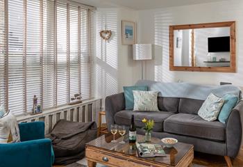 The living area offers ample room for the whole family to snuggle up and watch a film.