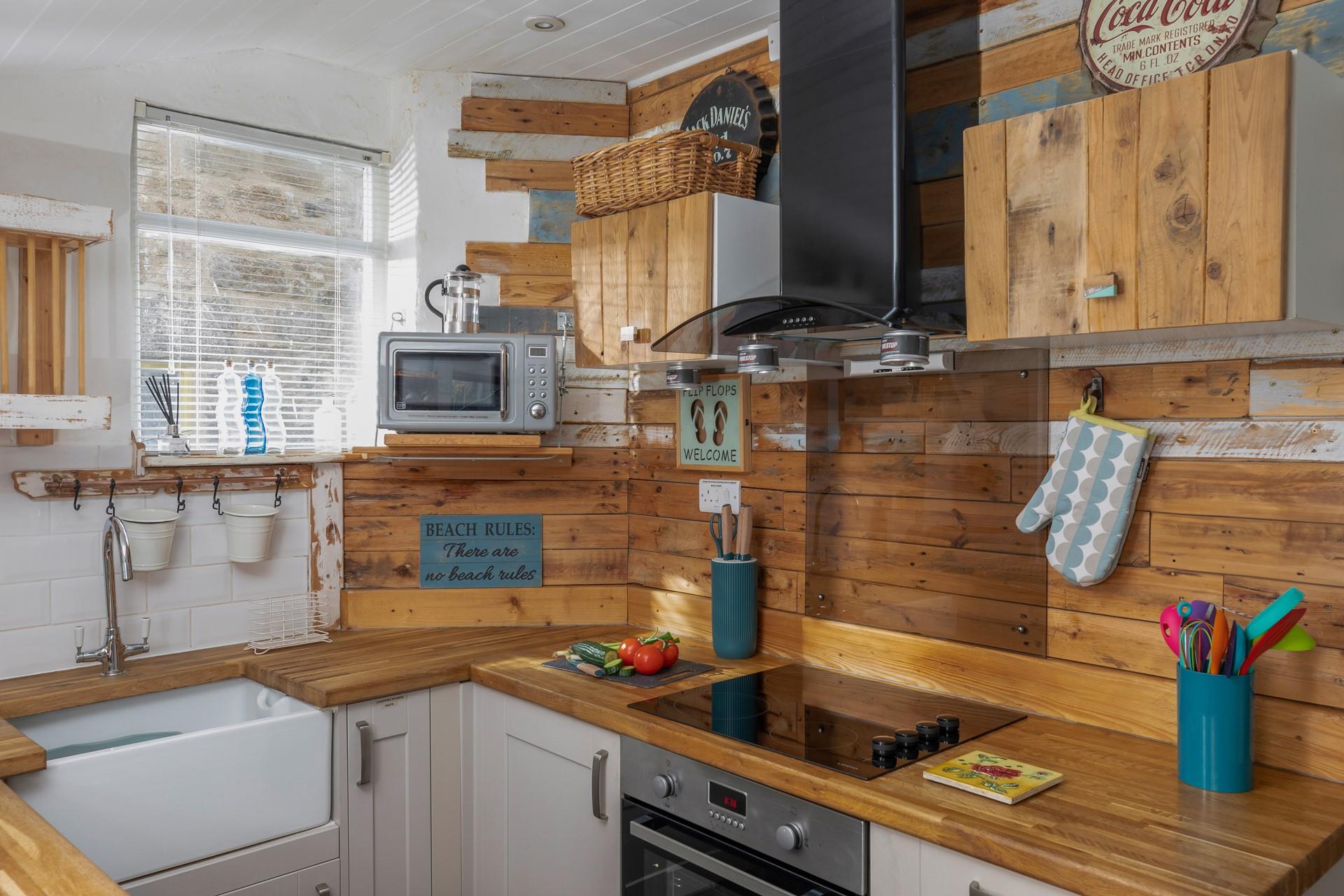 The beautiful rustic kitchen is stylish with all you need to prepare a meal for the family.
