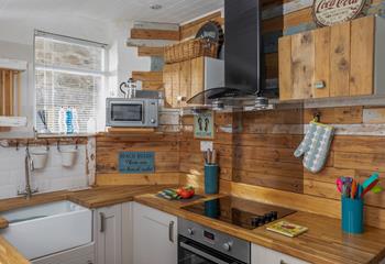 The beautiful rustic kitchen is stylish with all you need to prepare a meal for the family.