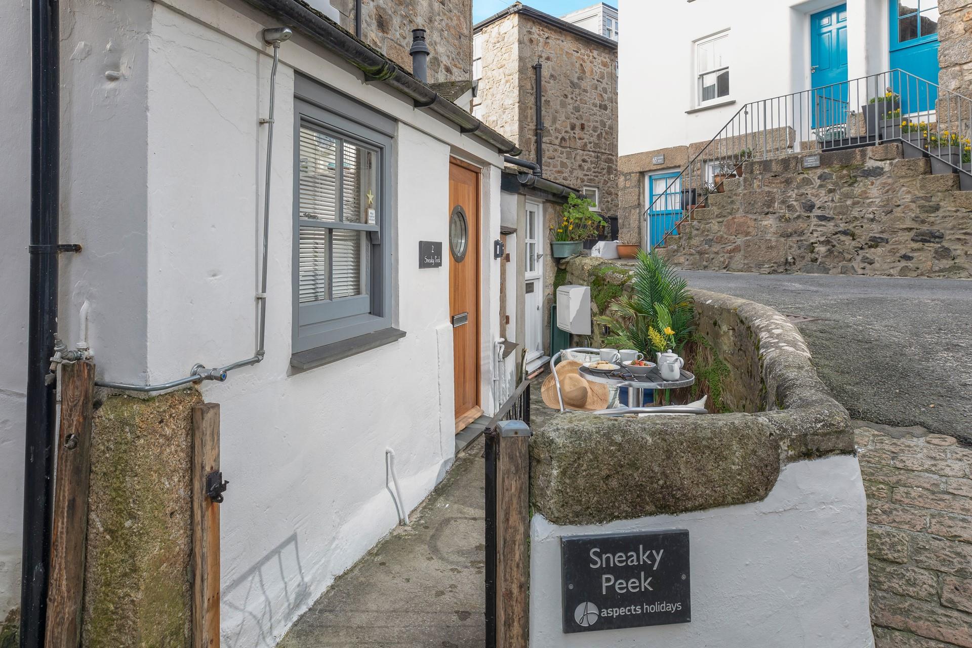 The outside area is a charming little sun trap, perfect for a morning coffee or an evening glass of wine.