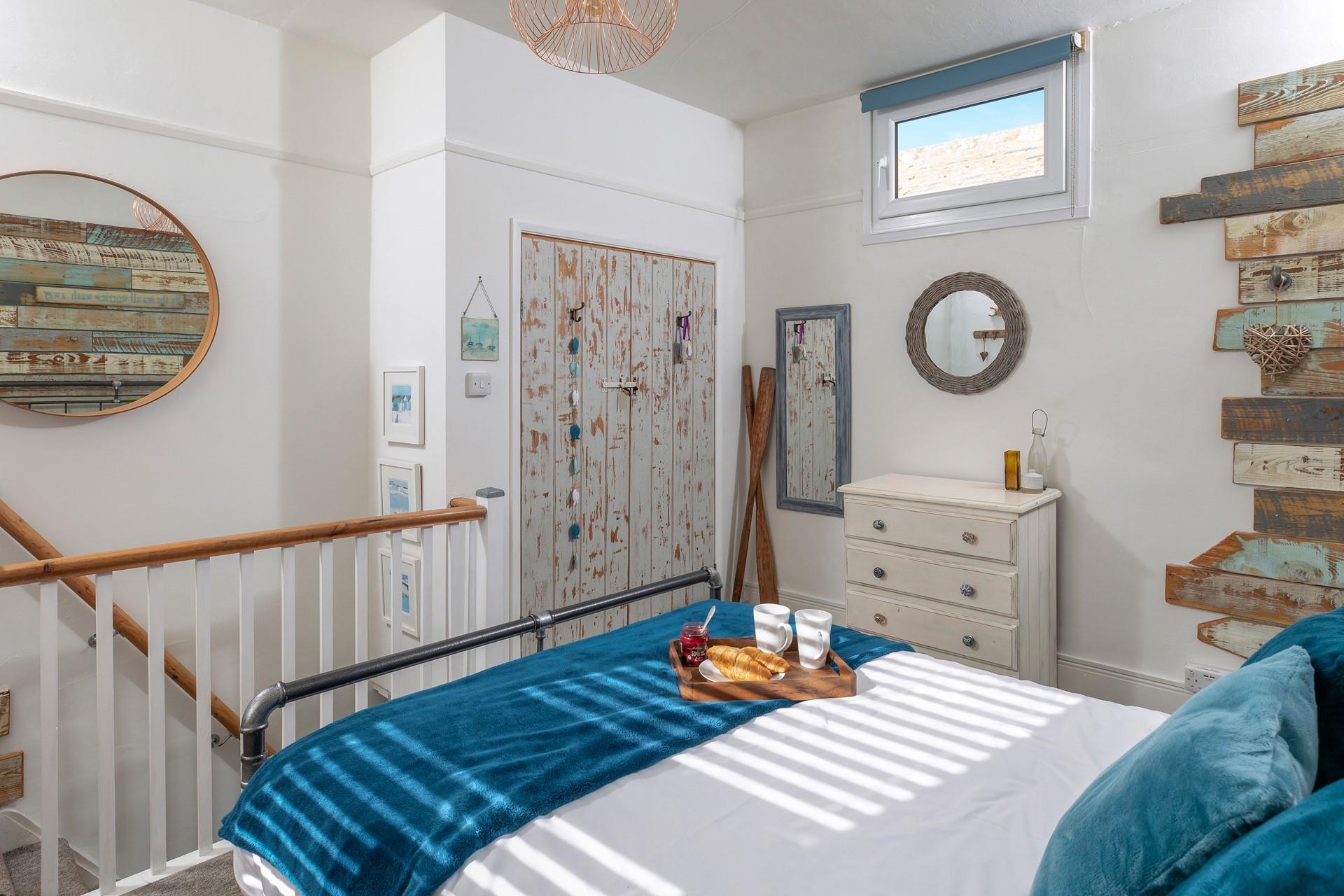 This wonderfully unique bedroom reminds you just how close to the sea you are.