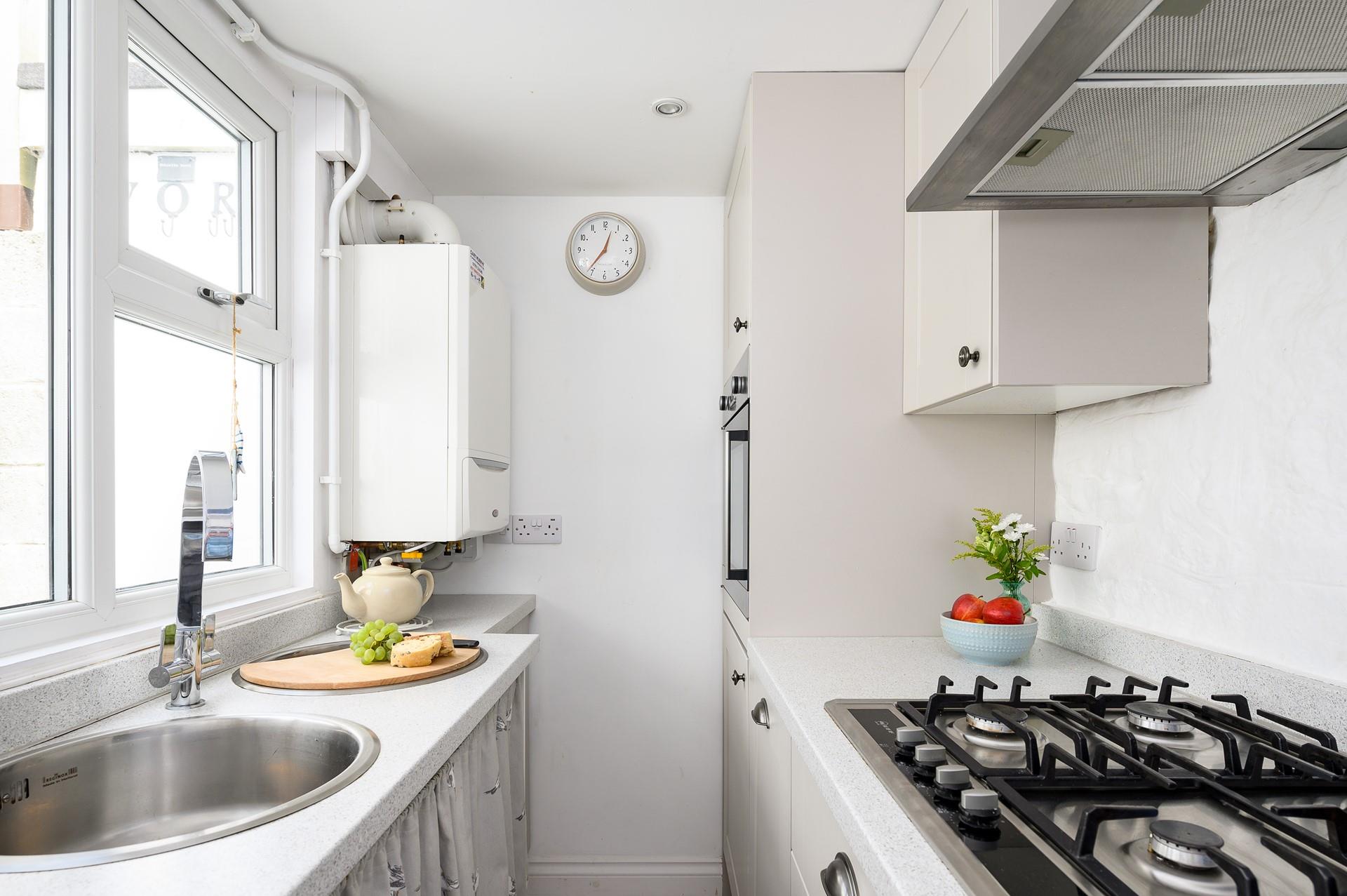 Filled with modern appliances, the kitchen makes whipping up delicious home-cooked meals an absolute breeze.