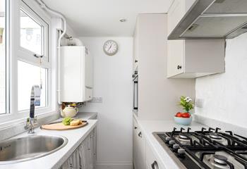 Filled with modern appliances, the kitchen makes whipping up delicious home-cooked meals an absolute breeze.