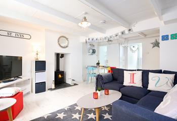Decorated in bold seaside colours, Ivors Cottage is a stunning coastal retreat.