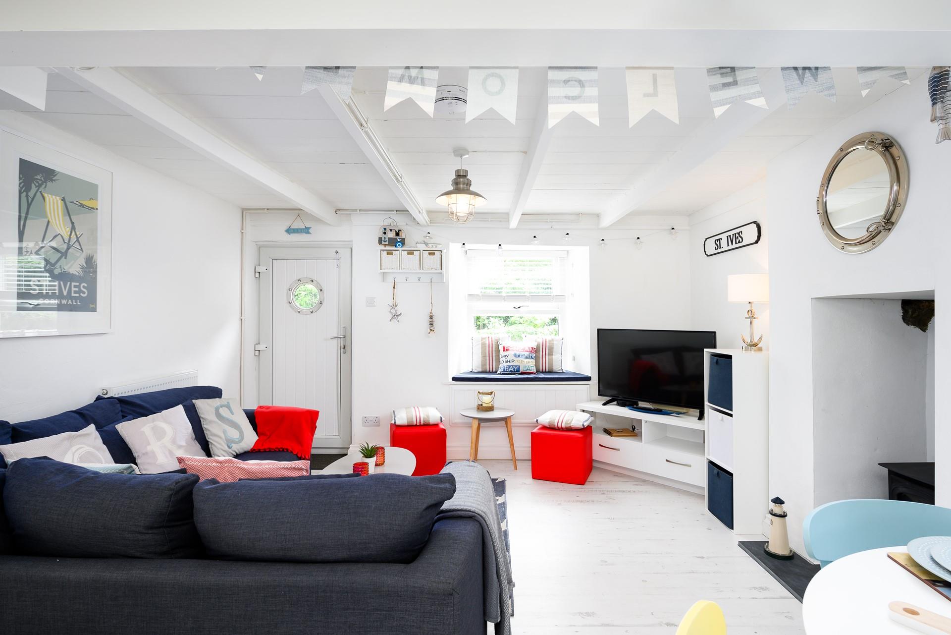 There are thoughtful touches of nautical decor throughout the property, including a porthole window in the door.