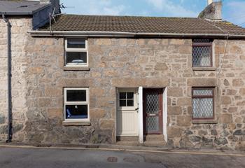 The cream door and slate signage make the property easy to spot! 