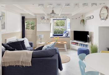 Decorated in a nautical palette, Ivors Cottage is a stunning coastal retreat.