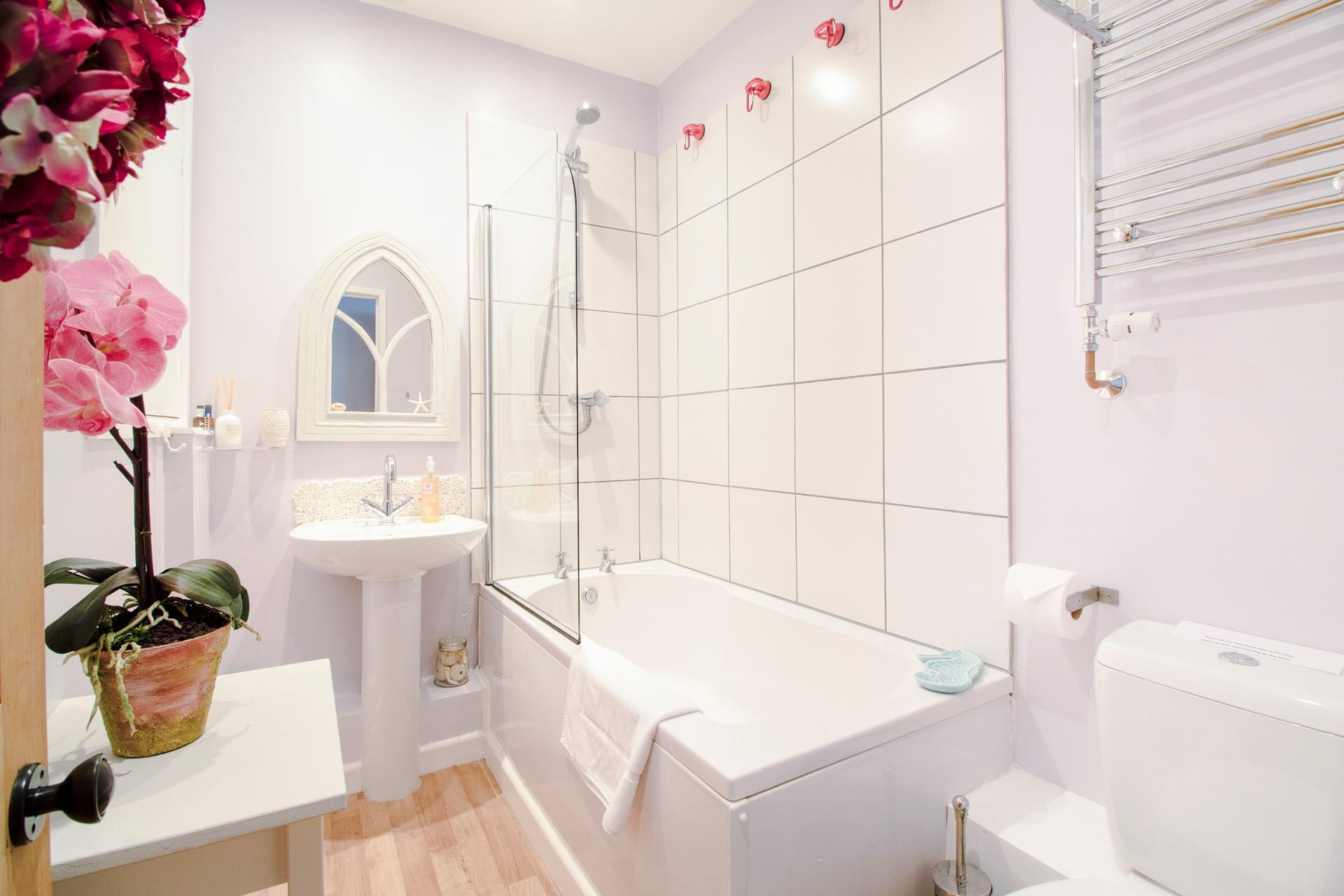 The family bathroom is spacious with handy wetsuit hooks!