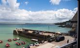 Far-reaching views from the living room over the harbour towards Hayle. - Thumbnail Image