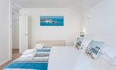 Bedroom 2 features calming blue and white interiors for you to enjoy a relaxing night's sleep. - Thumbnail Image