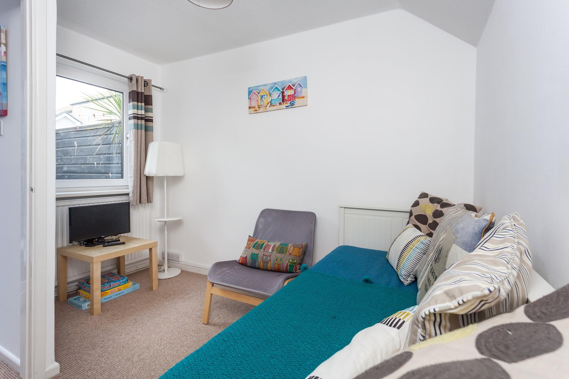 The snug room provides a quiet space to unwind.