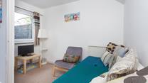 The snug room provides a quiet space to unwind.