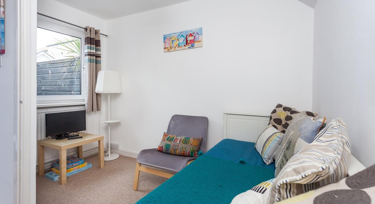 The snug room provides a quiet space to unwind.