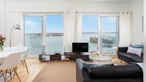Sit back and relax on the sofa and watch the turquoise waters in the harbour.