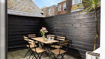 Step out to the patio and sip a cold drink in the sun.