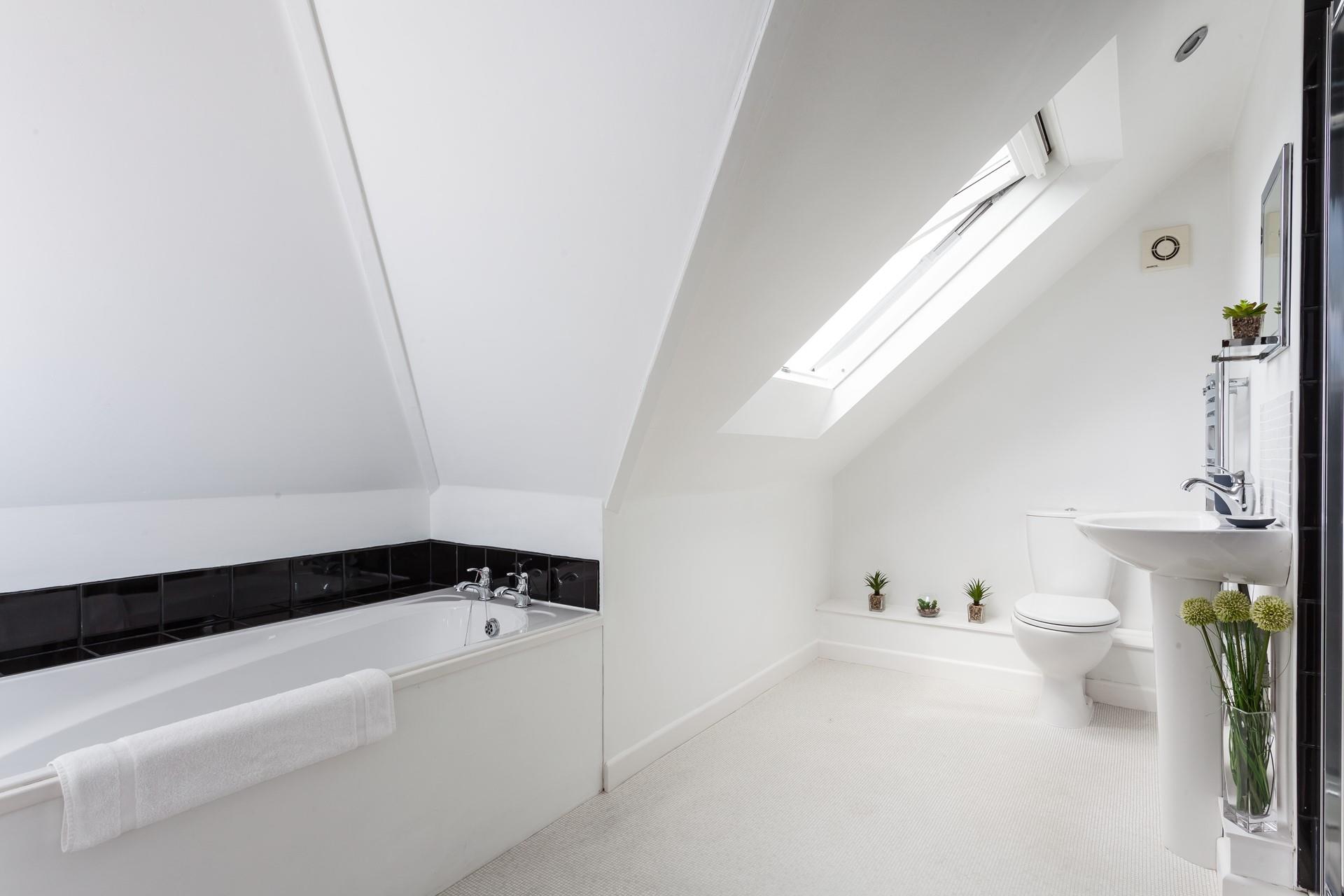 Bedroom 5 has a large en suite with a bath to soak in on chilly evenings.