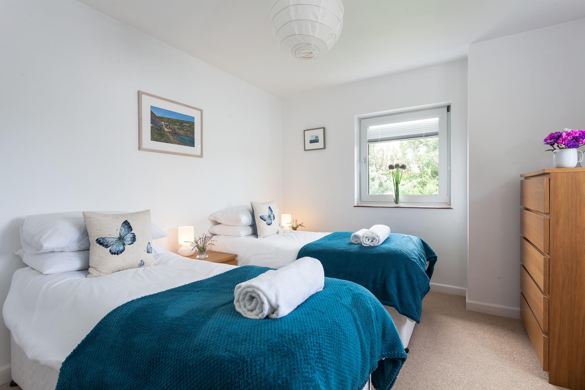 Bedroom 2 features cosy twin beds to snuggle into at night.