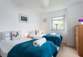 Bedroom 2 features cosy twin beds to snuggle into at night.