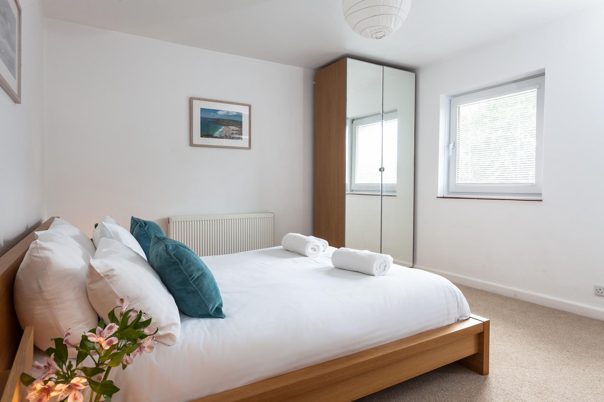 Bedroom 1 has a double bed for you to sink into after a day exploring Land's End.