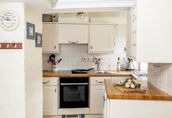 The kitchen is sleek, stylish and equipped with everything you need to rustle up delicious meals.