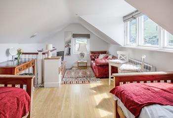 This quirky twin room has an open staircase, gorgeous views and even a sofa and TV; perfect for older children who want their own space.