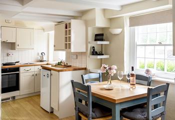 The open plan living area is quintessentially Cornish, with sash windows to let in the cooling breeze.