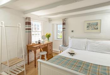 The double bedroom on the first floor has a sumptuous double bed along with a little en suite. 