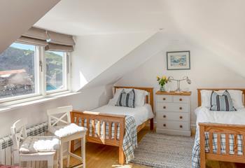 The top bedroom has the best views of the house, with views of the harbour and the famous house on the hill.